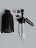 Black pump and spray nozzle set on a gray background