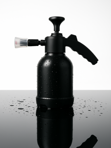 Black foam cannon on a reflective surface with water droplets